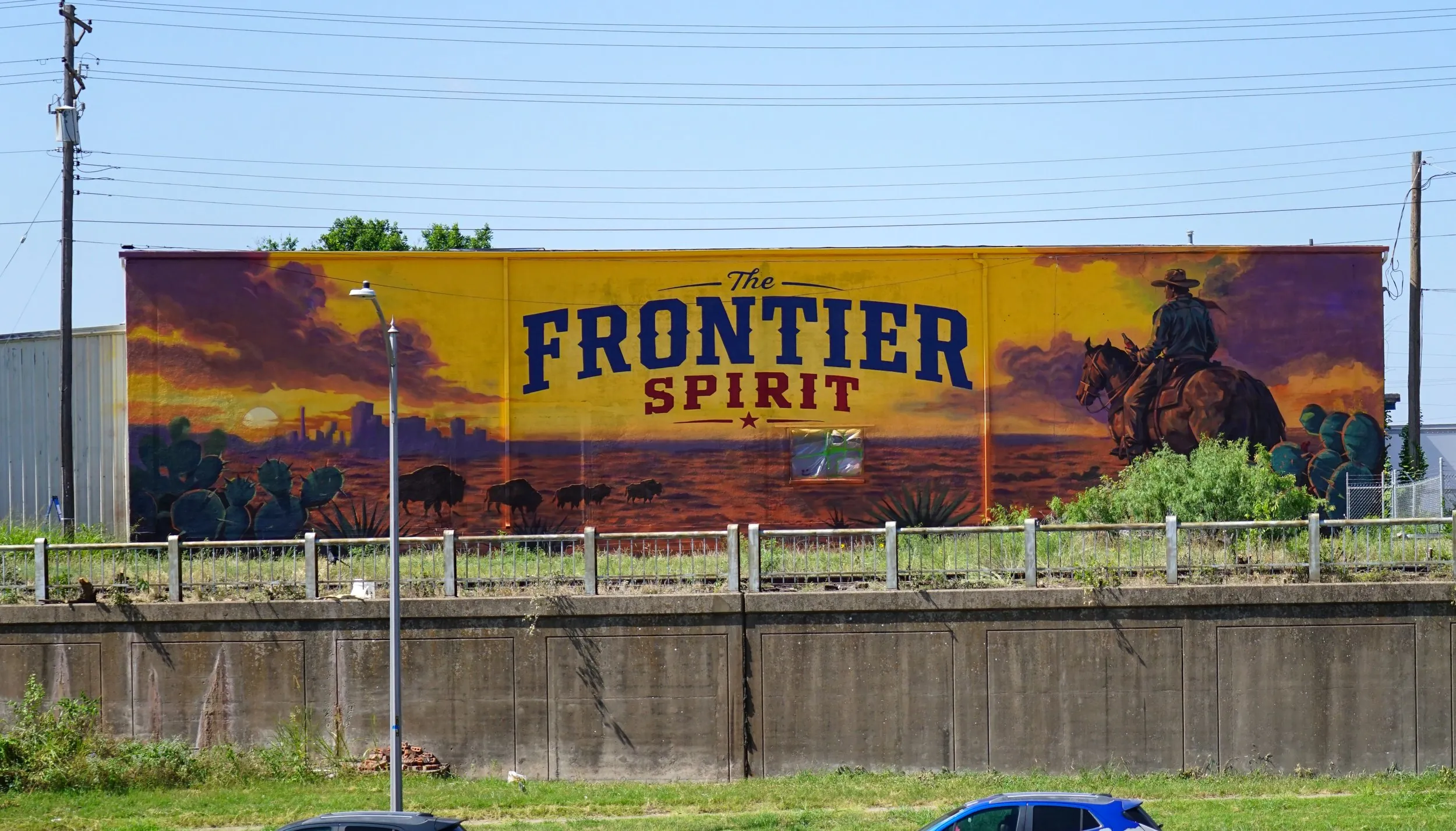 The finished Frontier Spirit mural for Coca-Cola on an exterior wall in Abilene, Texas, by Pezer97 Studios