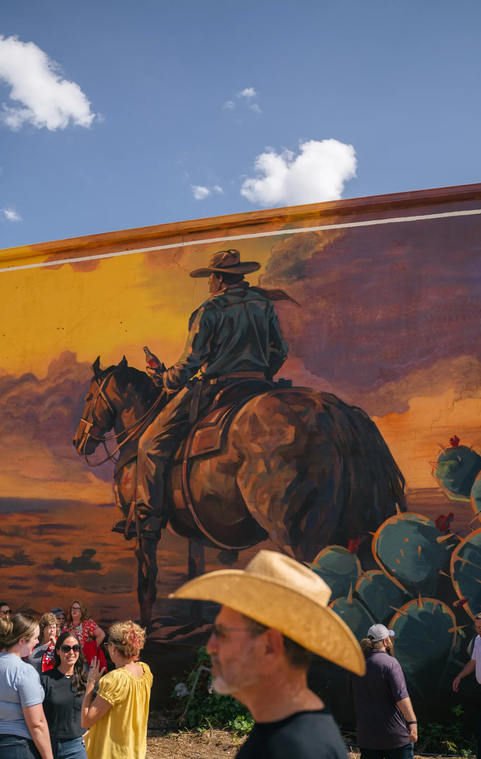 Hand-painted cowboy on horseback detail from the Frontier Spirit Coca-Cola mural in Abilene, Texas
