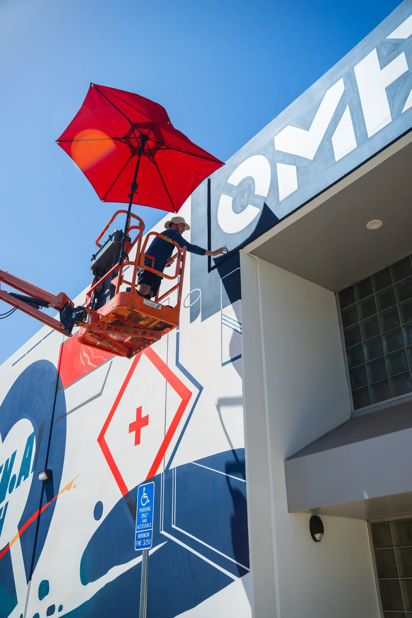 Close detail of the geometric shapes and lettering in the Omen AI mural by Pezer97 Studios