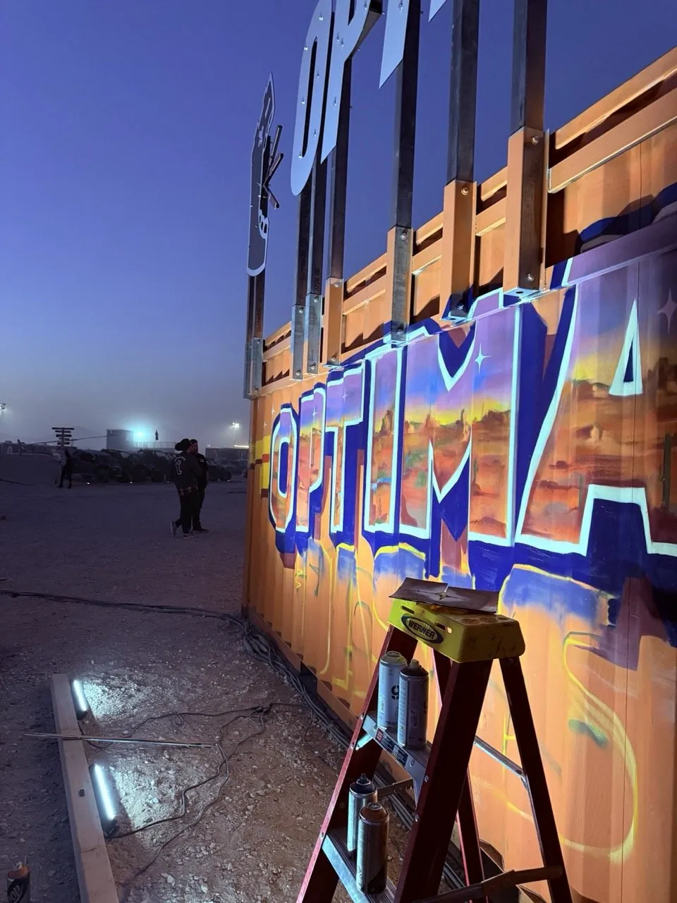 Pezer97 painting live graffiti mural for Optima Batteries brand activation at King of the Hammers event 2026